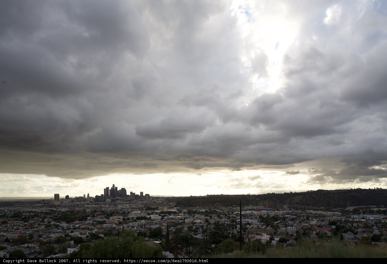 Cloudy metropolis on the horizon