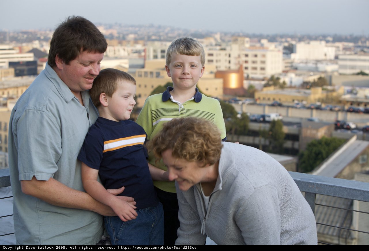 Family Portrait on Urban Rooftop at Dusk