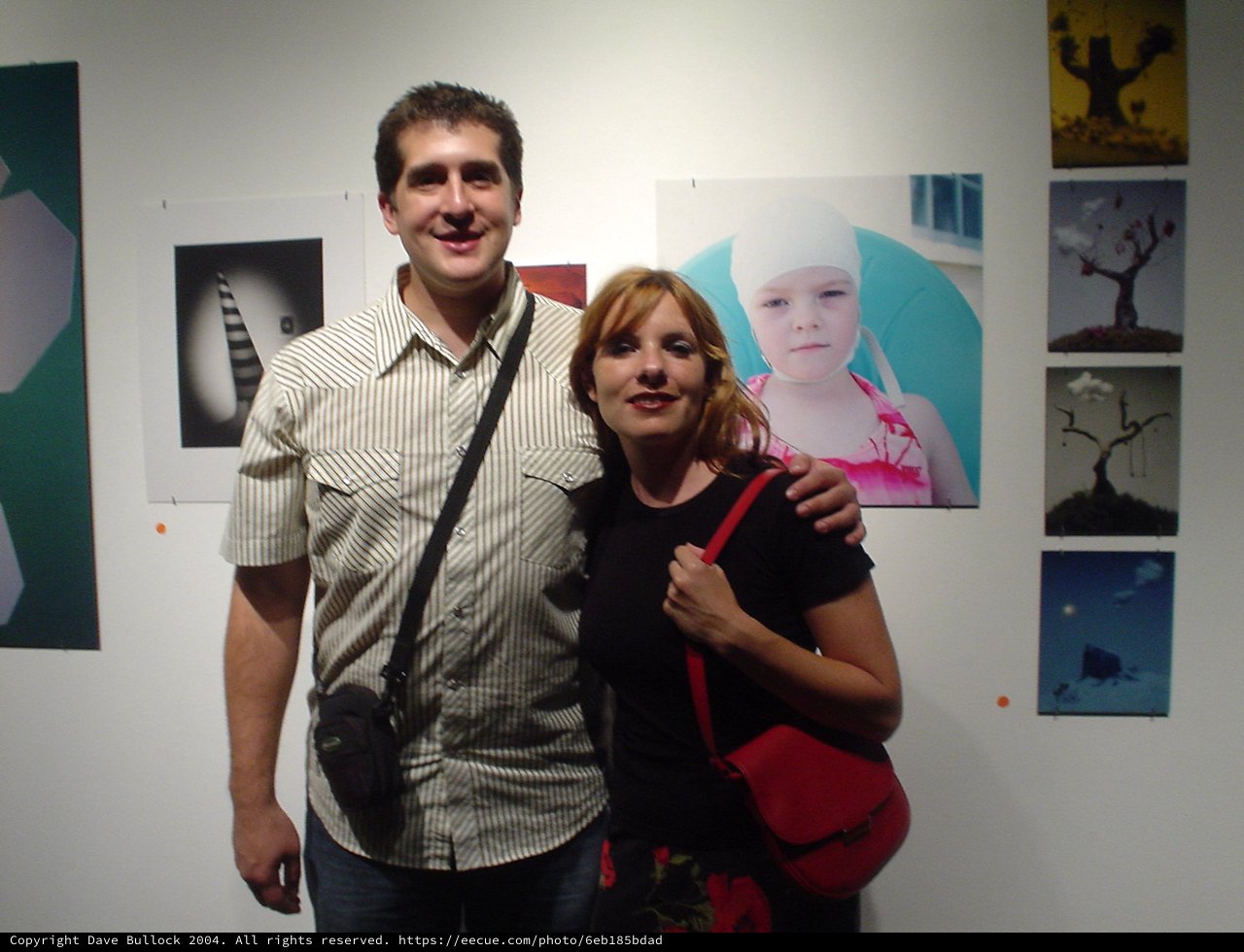 Couple Posing Together at Art Gallery Opening