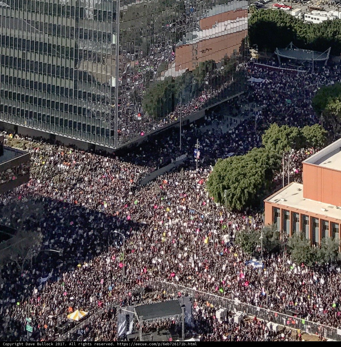 A Sea of People in Front of a Majestic Building