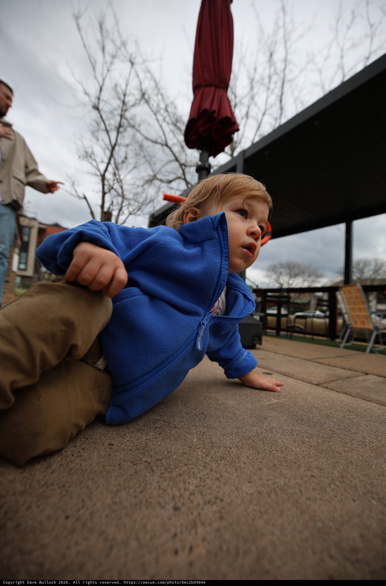 Young Child Playing on Outdoor Patio in Winter
