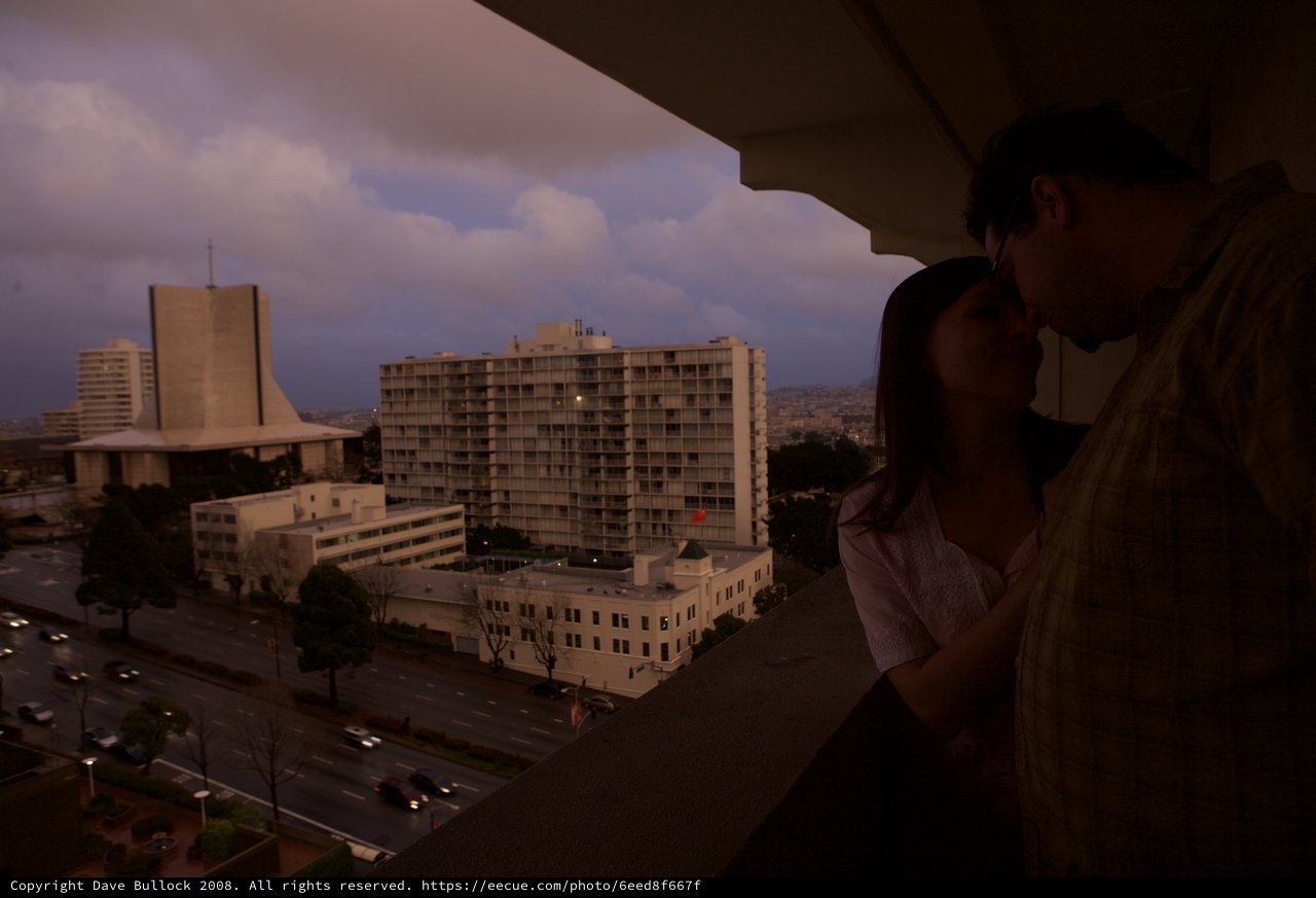 Romantic Twilight Kiss on San Francisco Balcony
