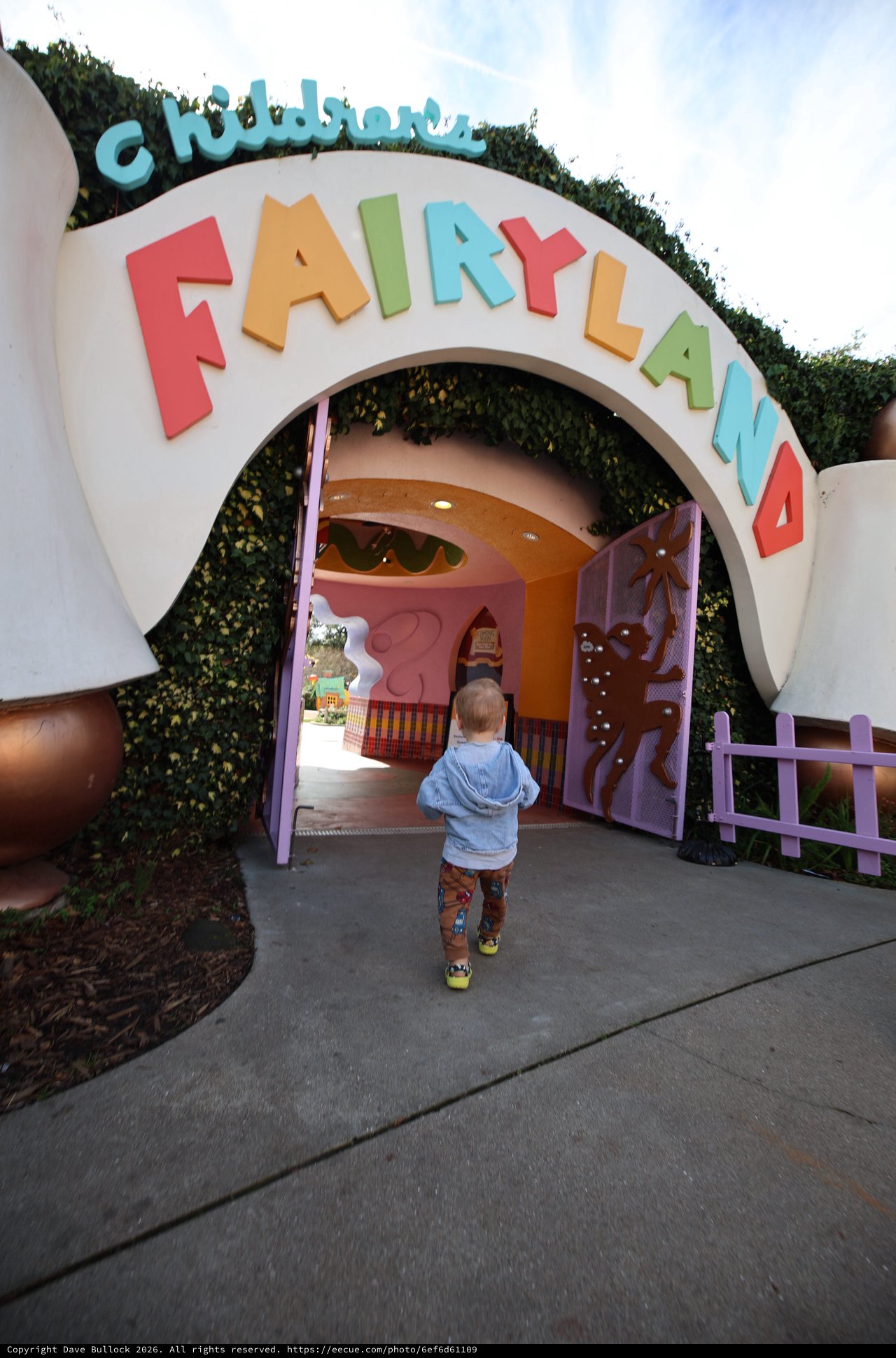 Child Entering Pixie Hollow Fairyland Attraction Entrance