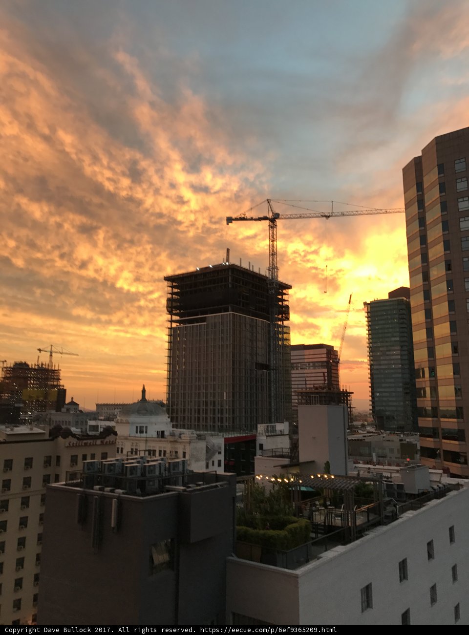 Cityscape Sunset with Construction Cranes