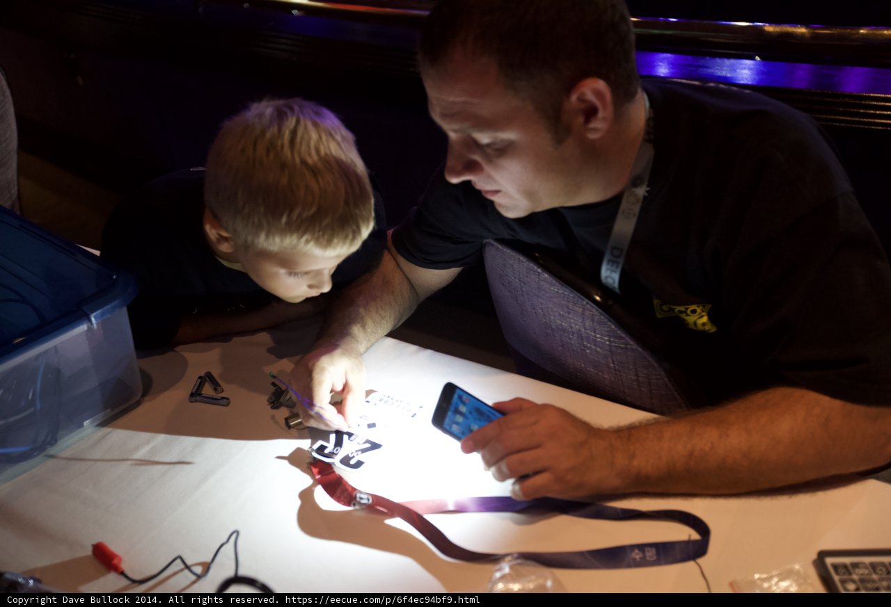 Father-Son Duo Working on Technological Project