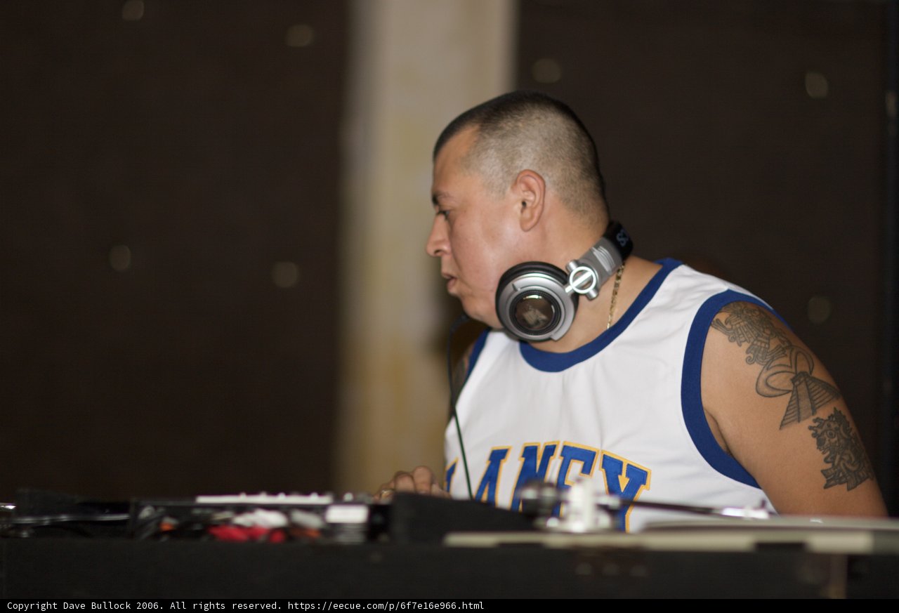 White Tank Top Musician Rocking the Turntable