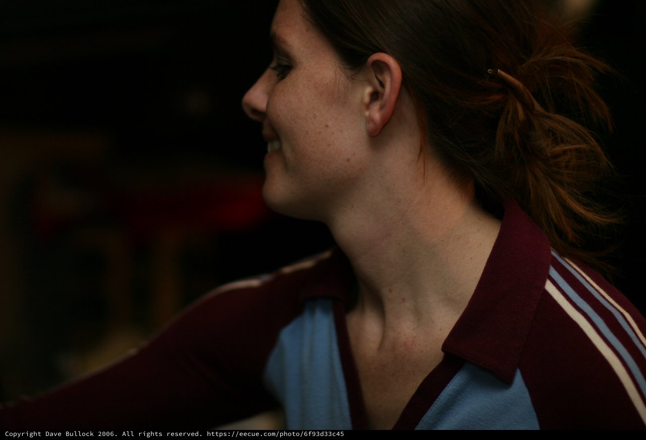 Candid Profile Portrait of a Smiling Young Woman