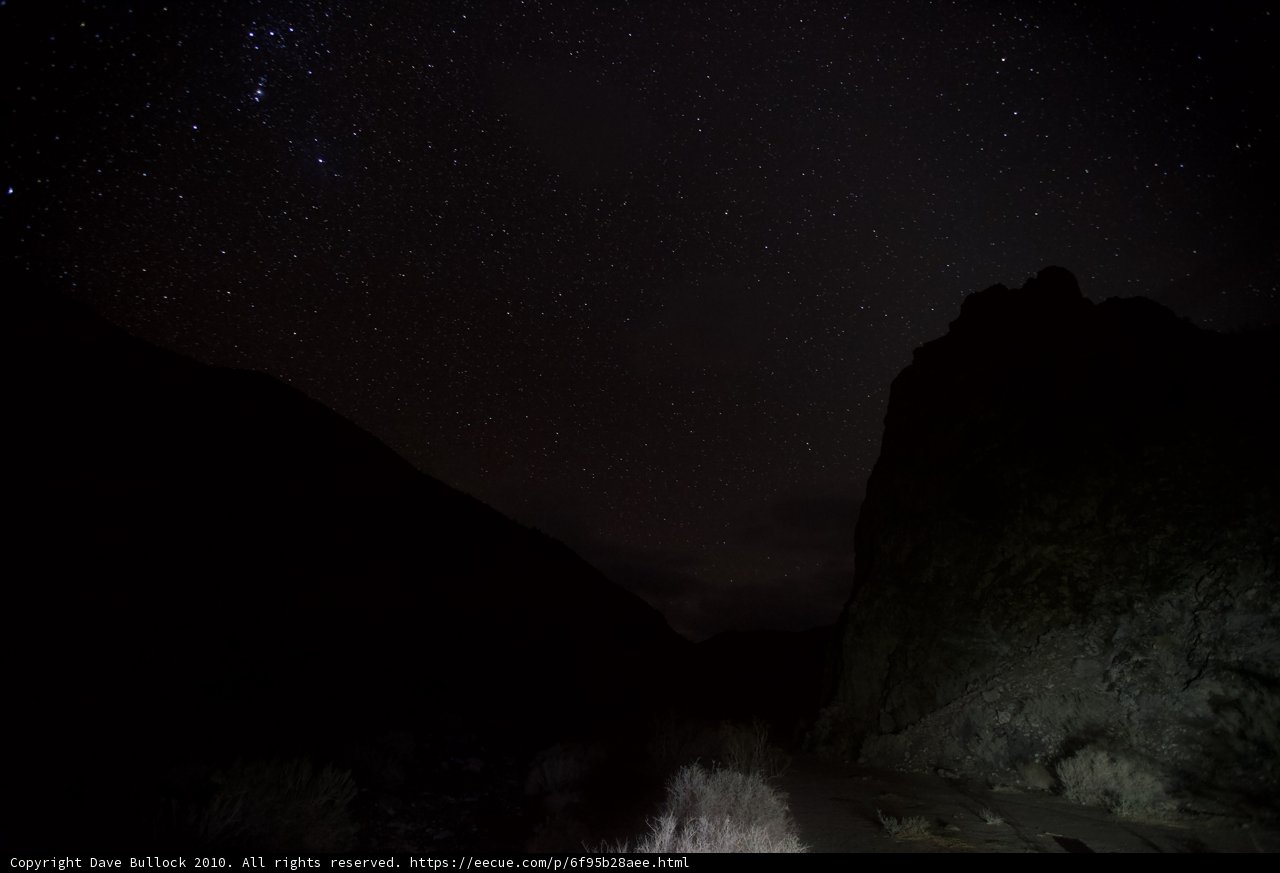 Starry Night Sky Above the Rocky Landscape