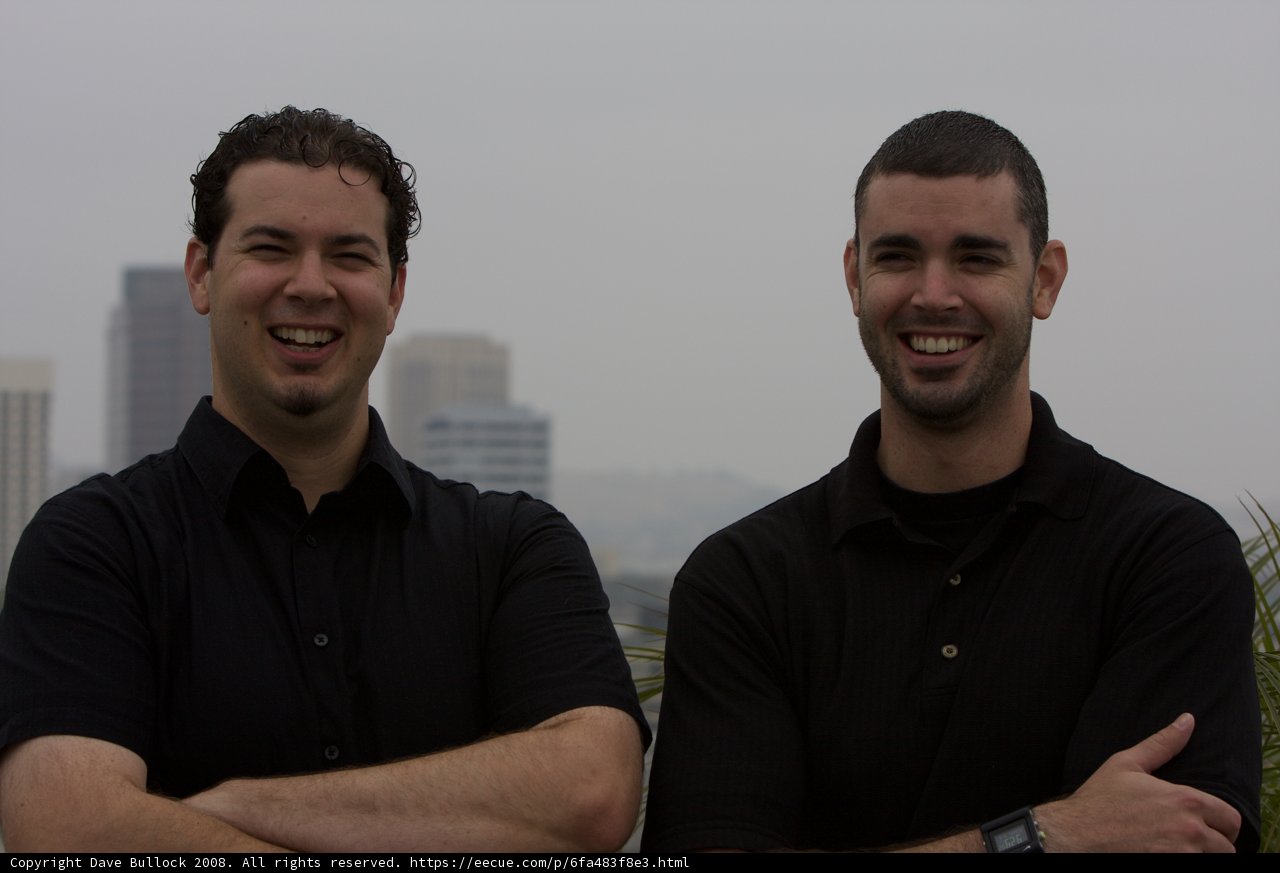 Smiling Men with Cityscape Background