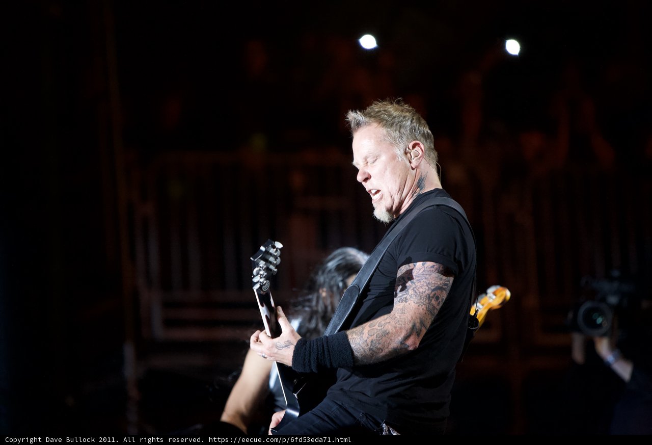 James Hetfield rocks the stage with his guitar and tattoos