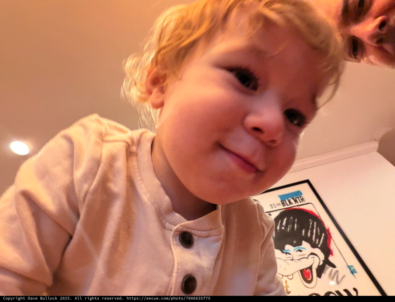 Young Child in Cozy Pink Outfit at Home