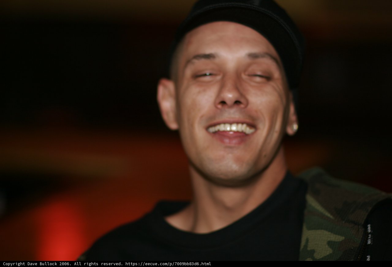 The Smiling Man in the Black Hat