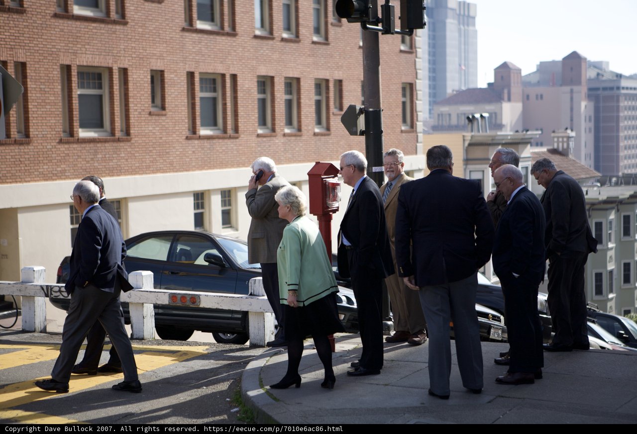 A Formal Crowd on the City Sidewalk