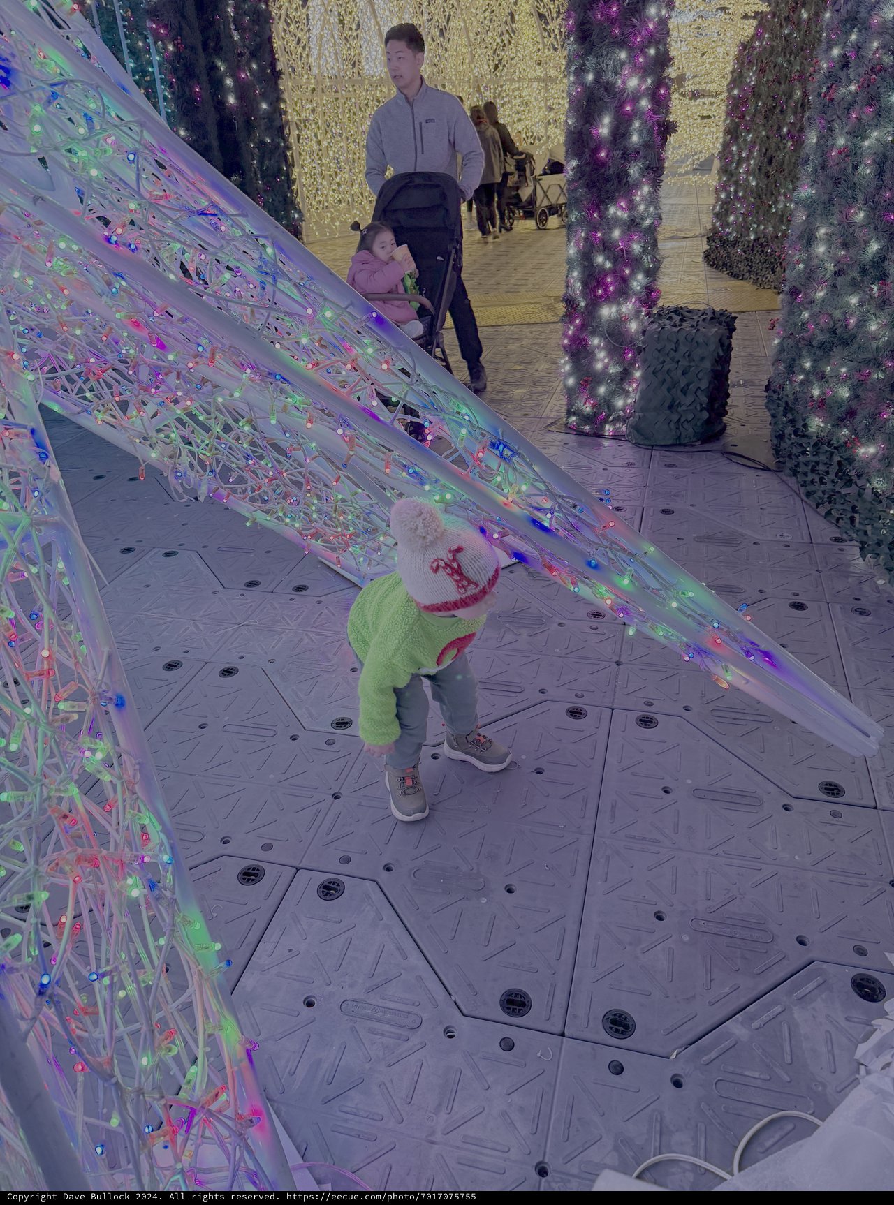 Child Explores Interactive Light Installation Display