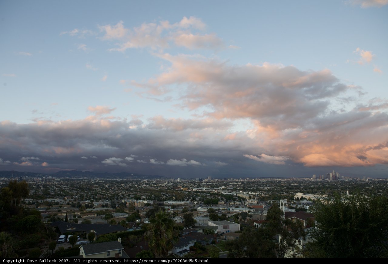 Cloudy Cityscape View from Hillside