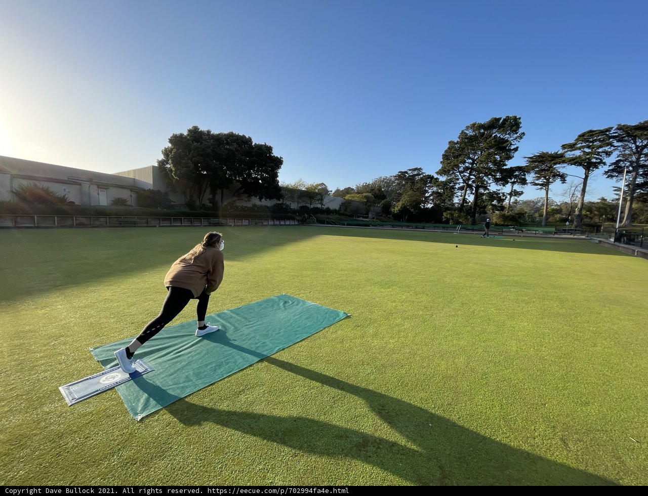 Playing Tennis on the Green Lawn