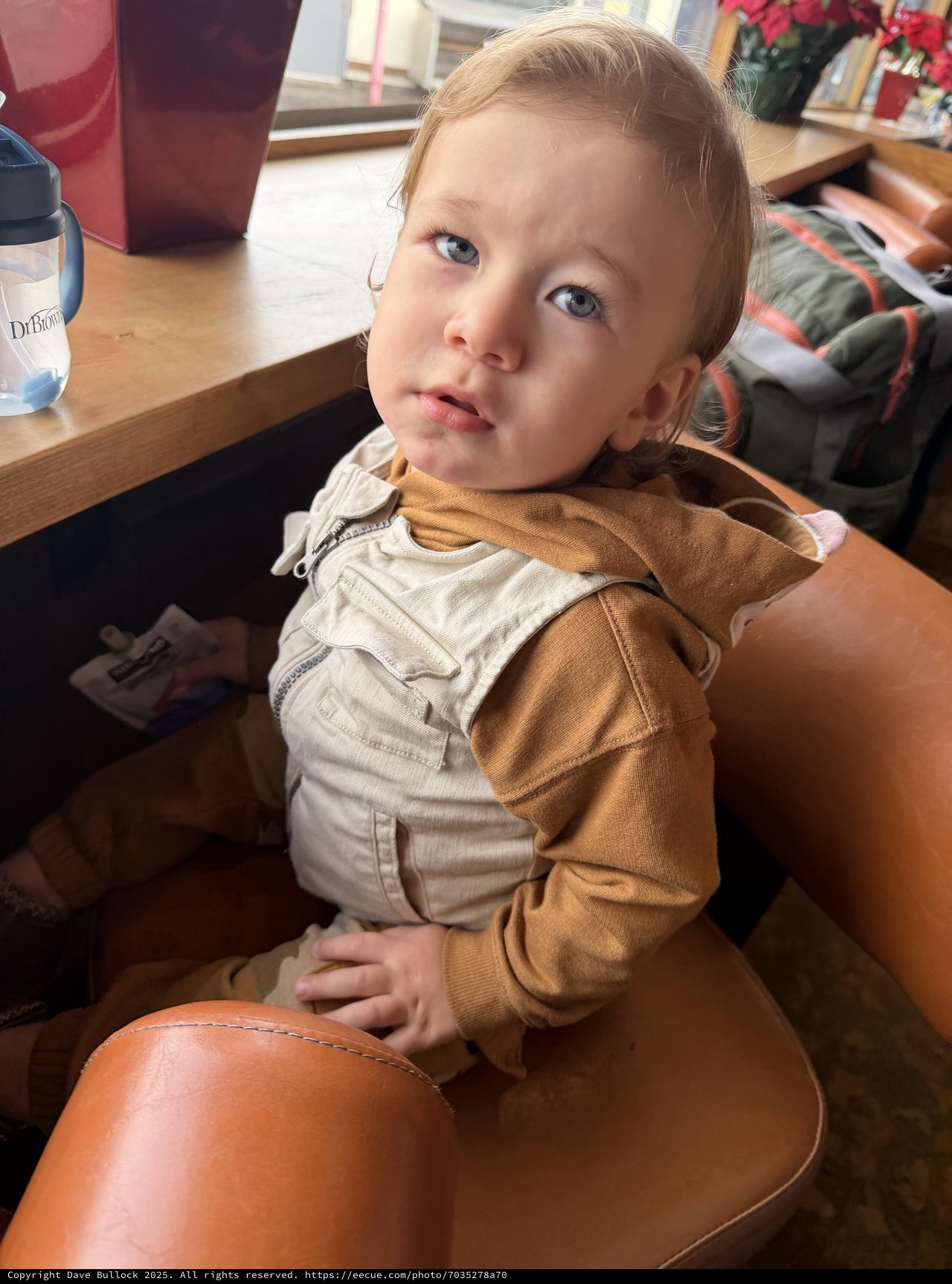 Young Child in Beige Outfit at Home