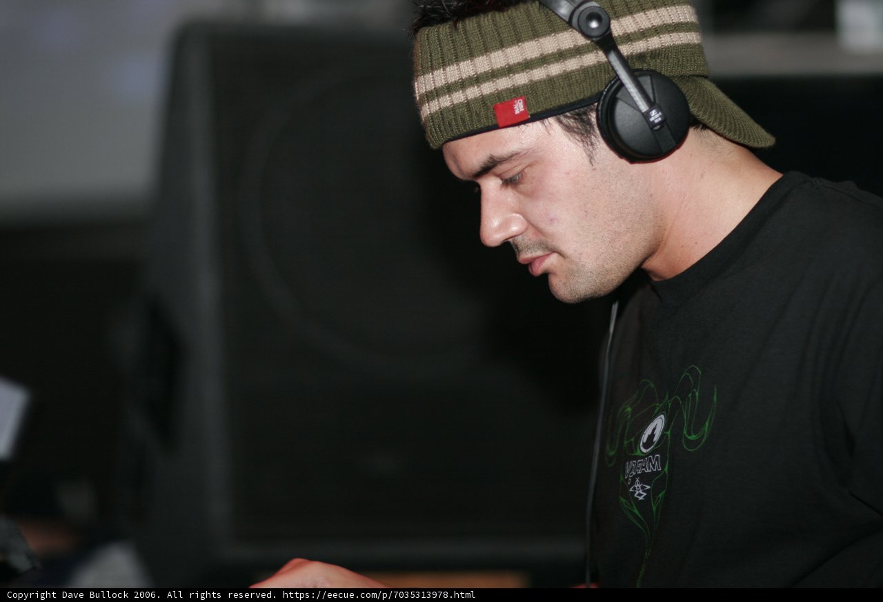 Black-capped man grooving with his beats