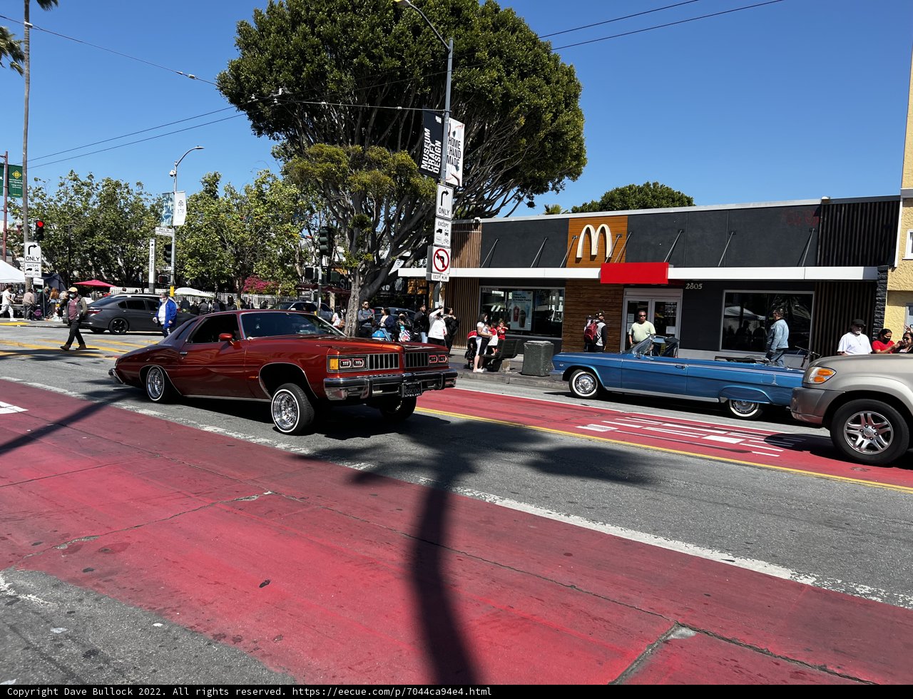 Red Coupe Parked on Busy City Street