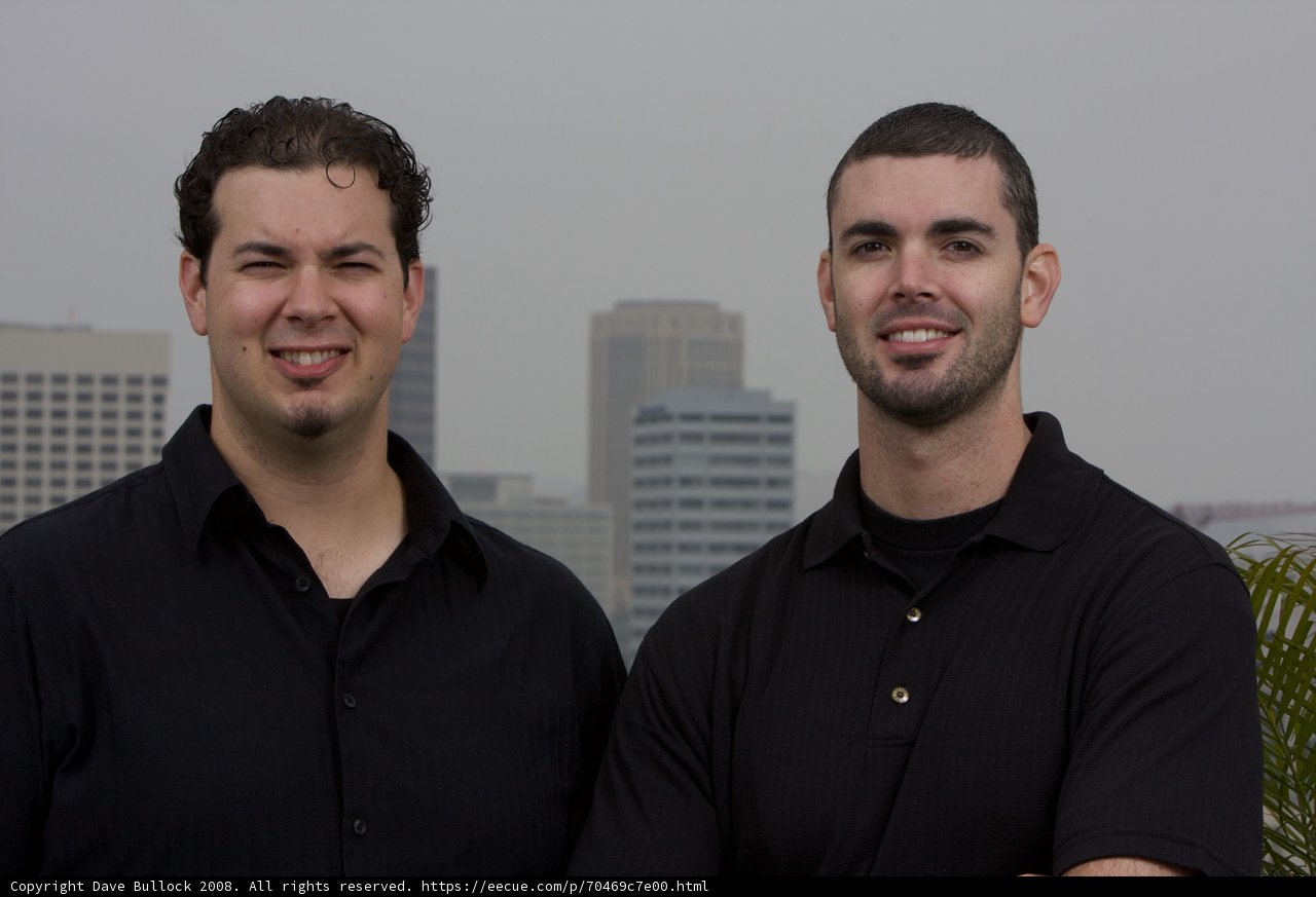 Dan and Dave, Smiling in Front of a Skyscraper