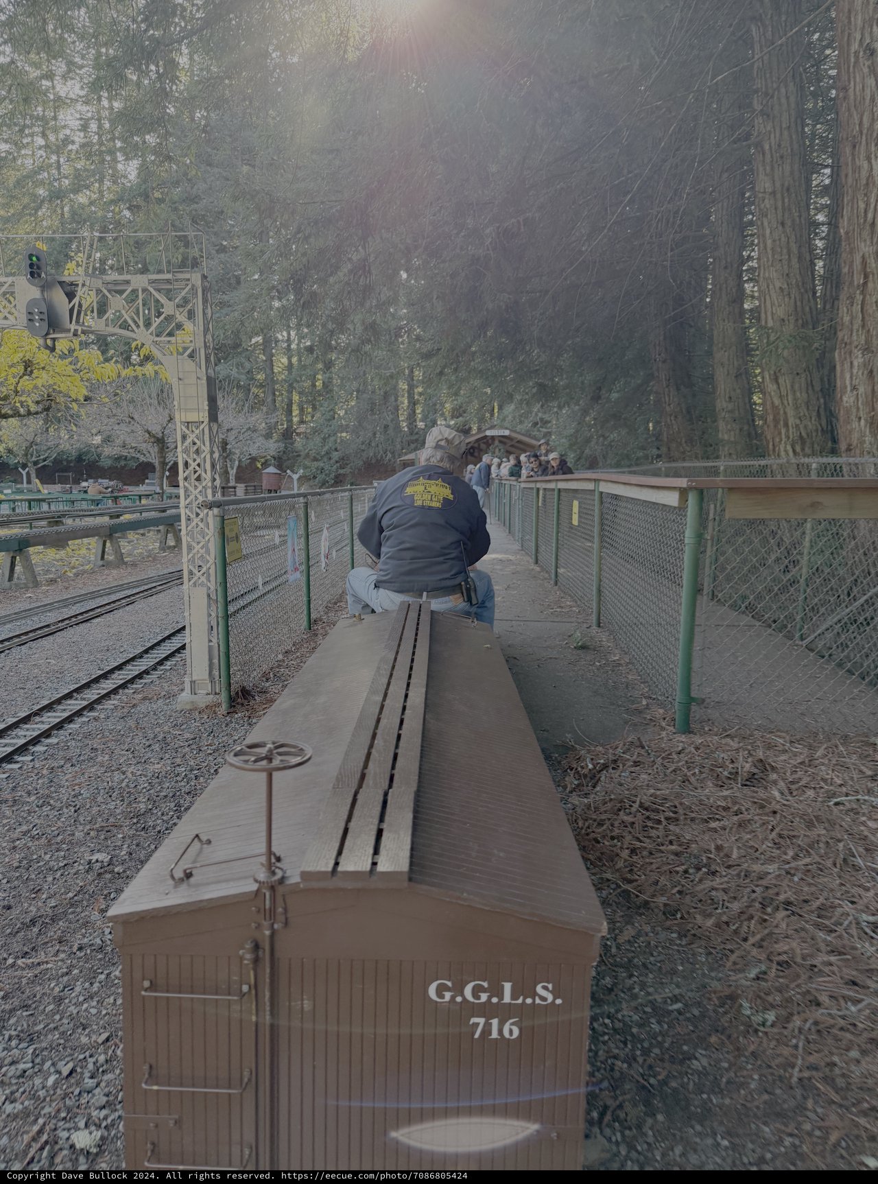 Vintage Railway Worker Maintaining Historic Train Car