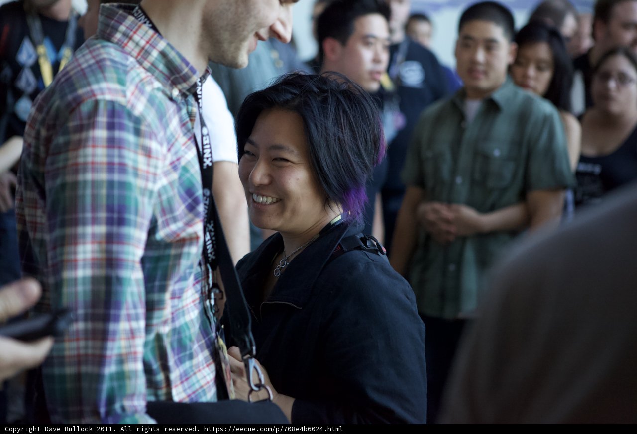 Smiling Couple in a Crowded Room