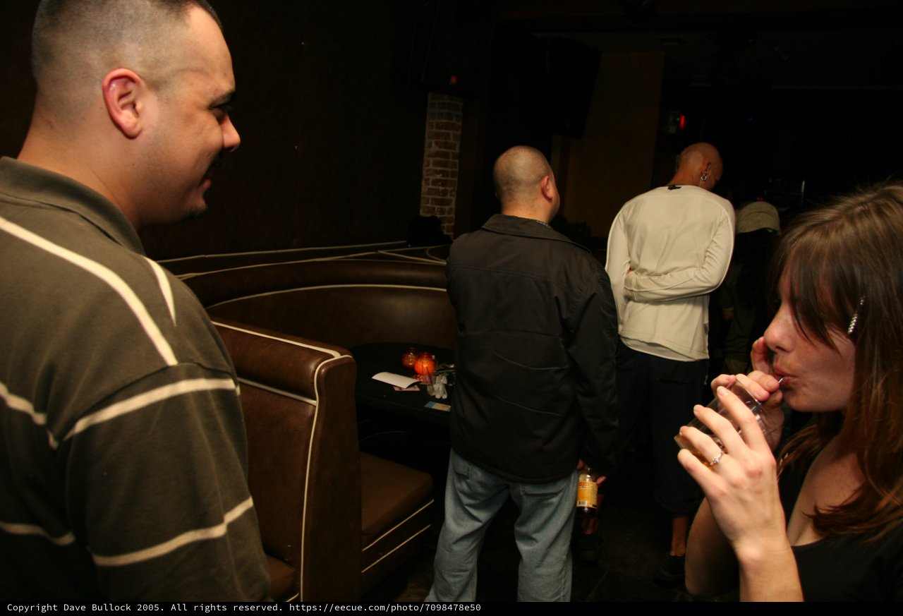Late Night Lounge Gathering in Dim Club Setting