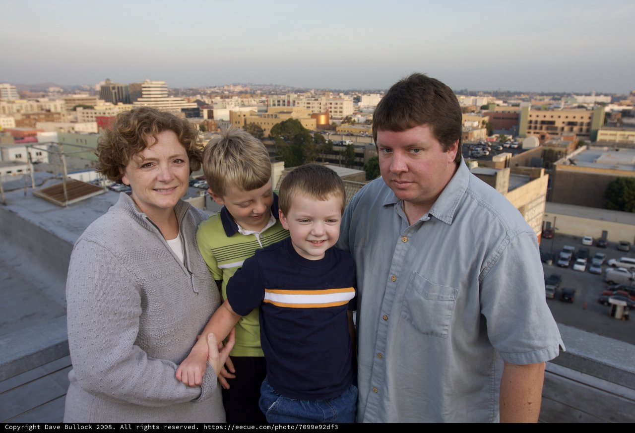 Family Portrait on Urban Rooftop at Dusk