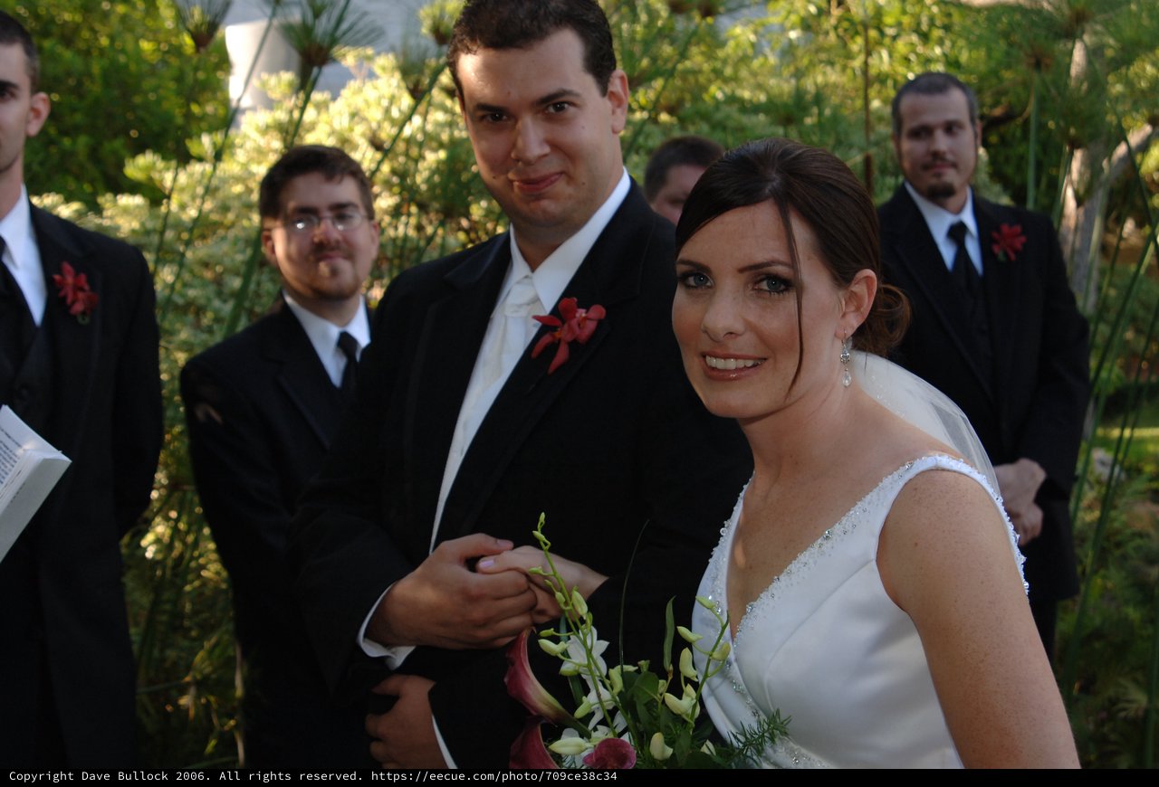 Bride and Groom Exchange Rings at Outdoor Ceremony