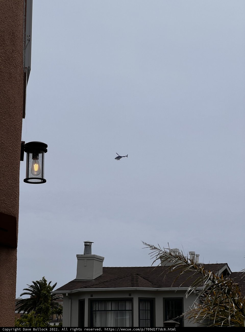 Aerial View of a House with a Helicopter and Street Light