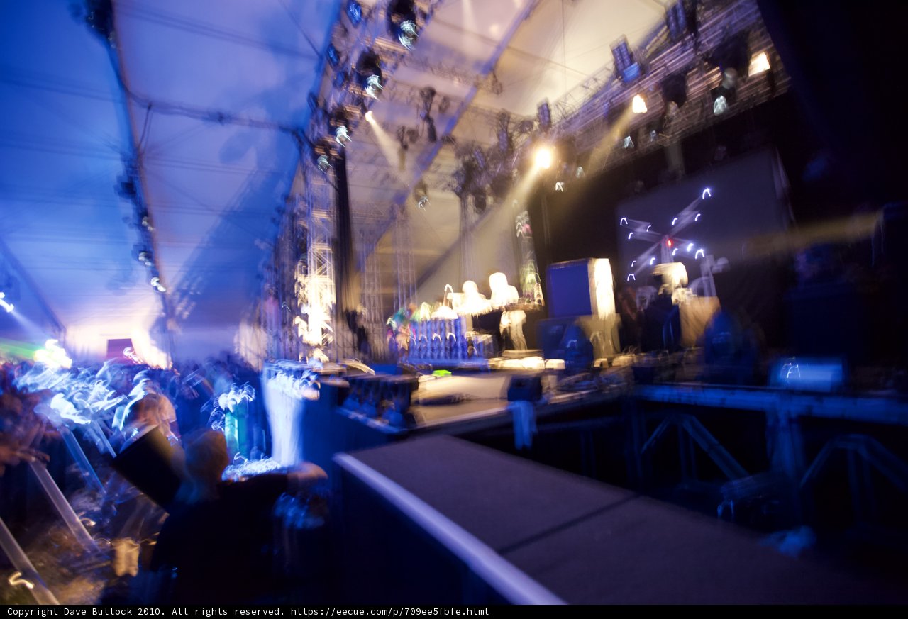 Blurry Concert Stage with Urban Crowd