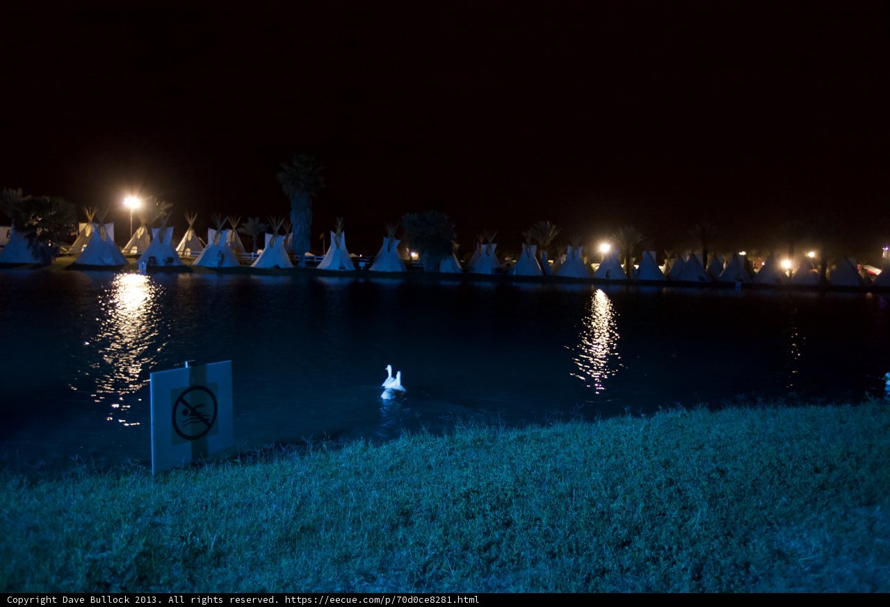 Night Boating on the Lake Caption: A serene and captivating view of Altadena’s lake at Coachella during HDRThursday. The perfect night getaway surrounded by nature and stunning lighting, with a few boats and people enjoying the peaceful scenery.