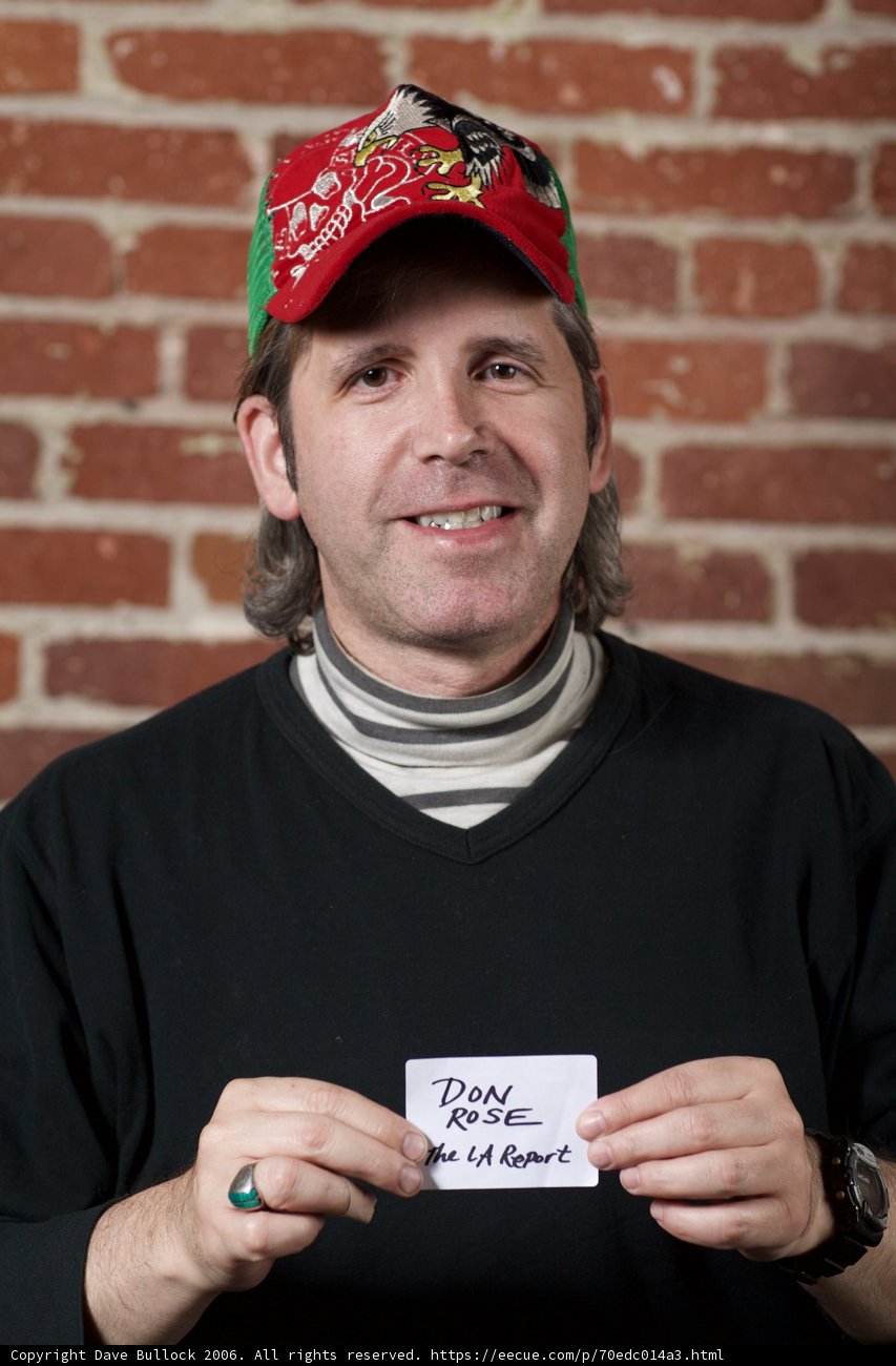 Red-Hatted Chuck Fleischmann Holds Document Sign