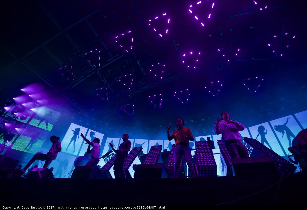 Group Performance Under Purple Lights