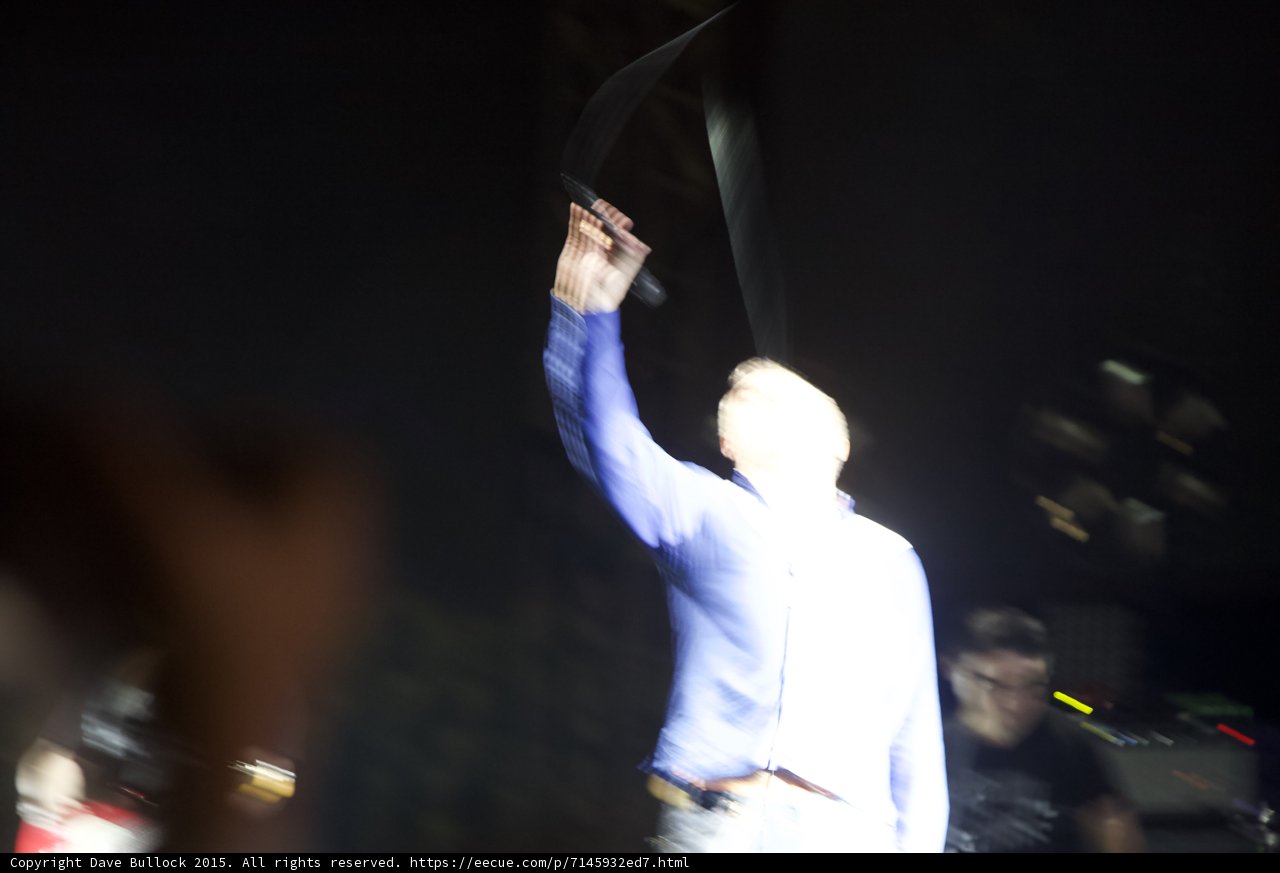 Morrissey Heavy Motion Blur From Behind Waving Shirt Overhead Blue Shirt Guitarist Dark Stage