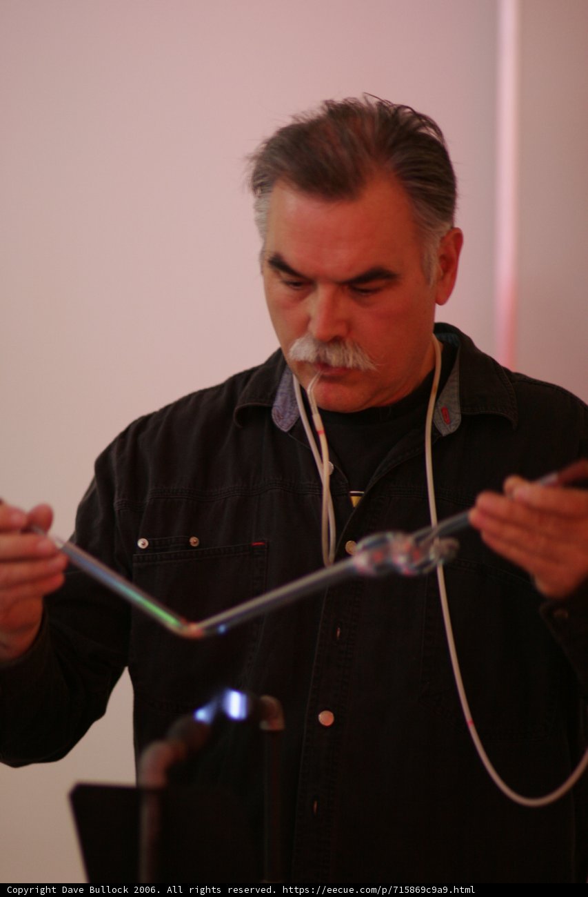 Man with a Mustache Holding a Microphone