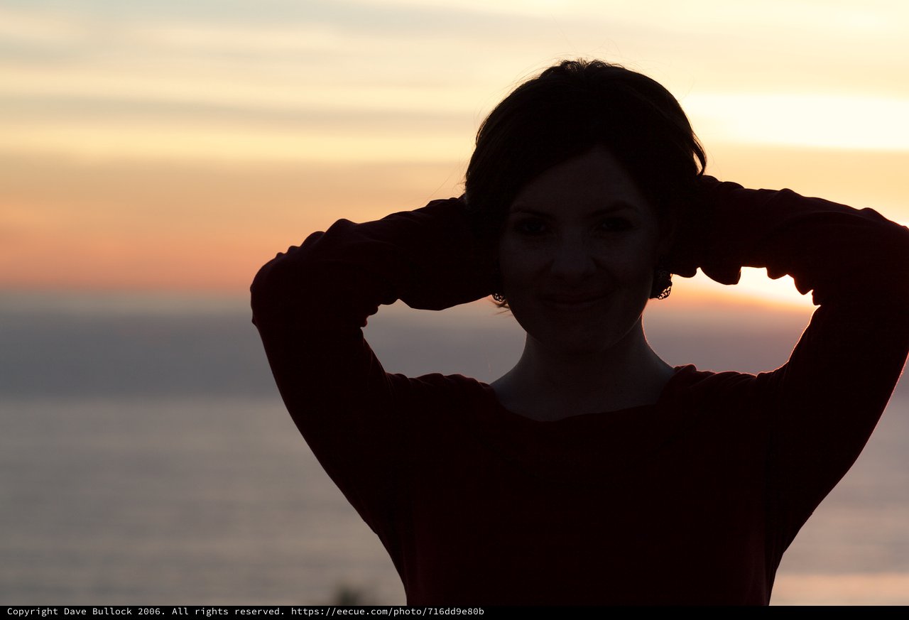 Silhouette of a Smiling Woman at Golden Sunset