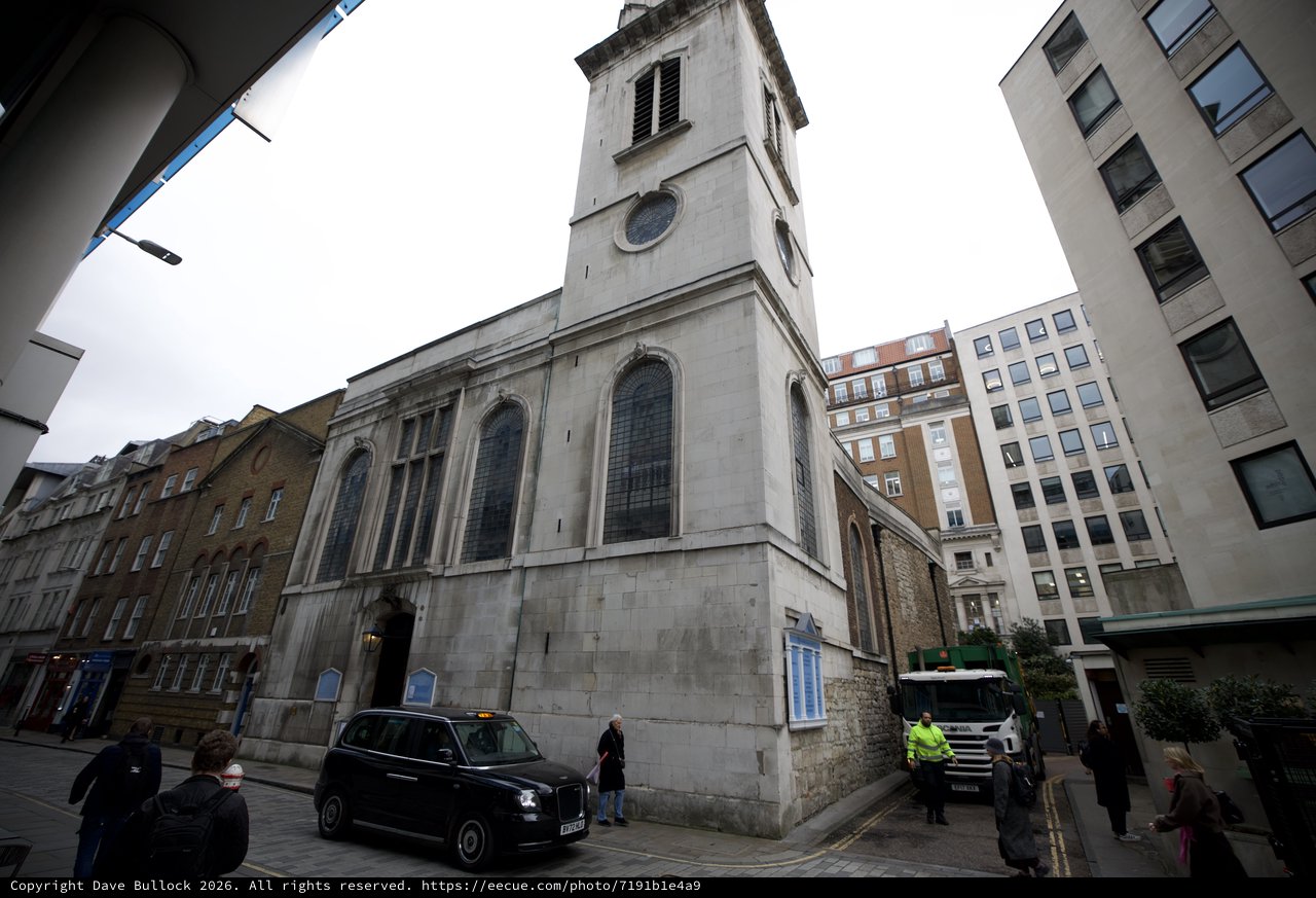 Historic Church Tower Among Modern London Buildings