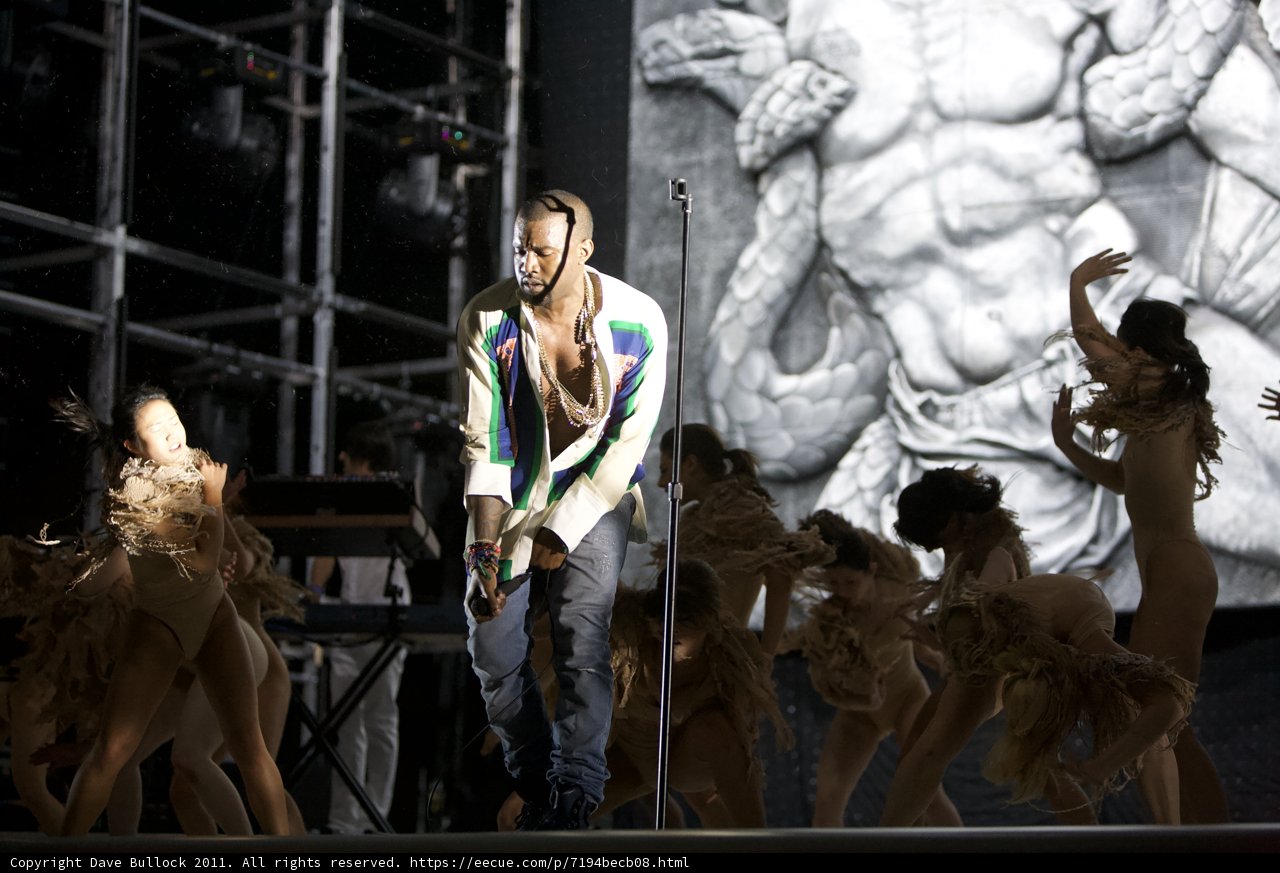 Kanye West performs with dancers on stage
