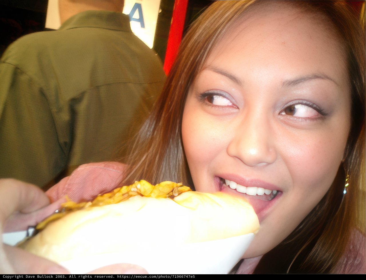 Bride takes a break with a delicious hot dog