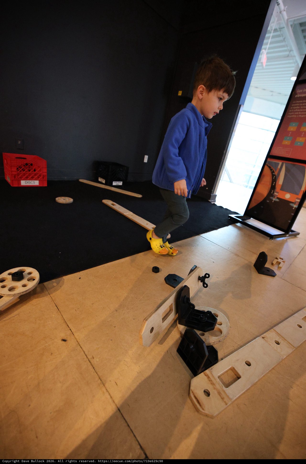 Child Exploring Interactive Science Museum Exhibit