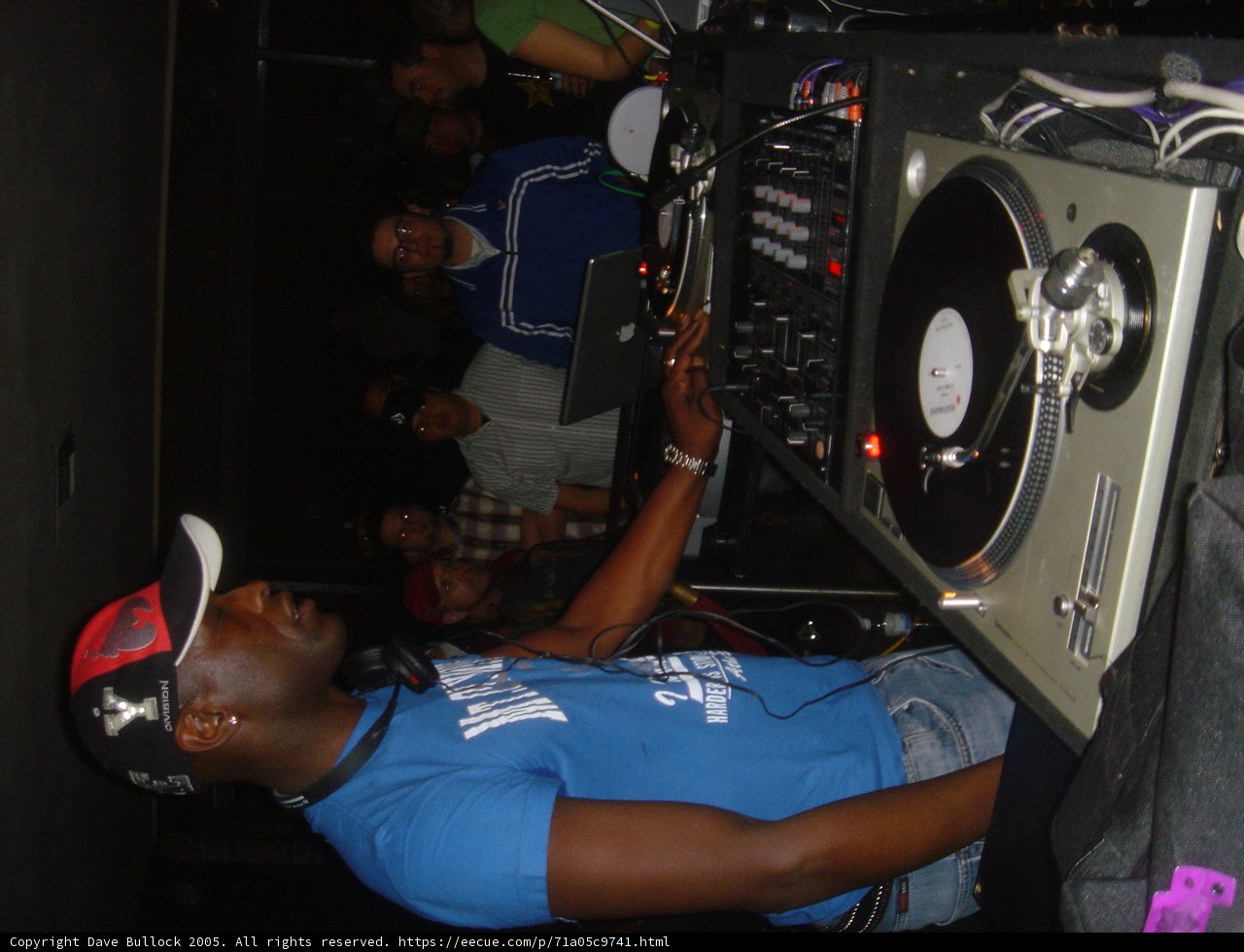 Blue-Shirted DJ at the Club