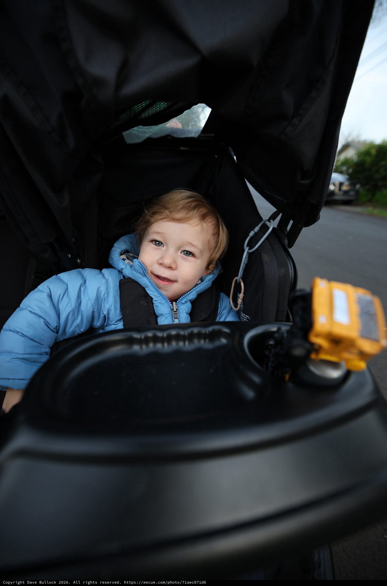 Curious Toddler Exploring Baby Stroller Controls