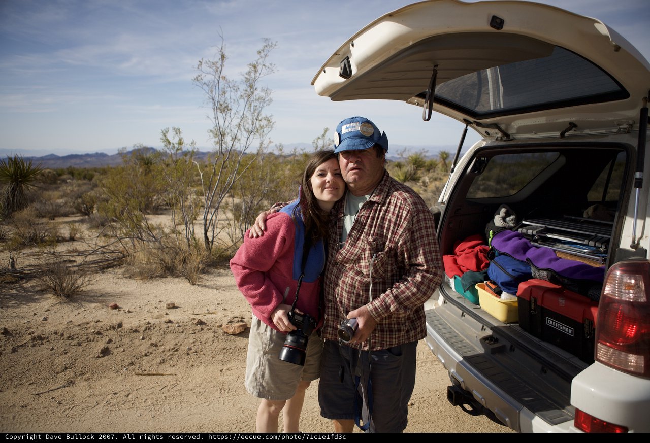 Desert Explorers Posing by Their SUV Truck