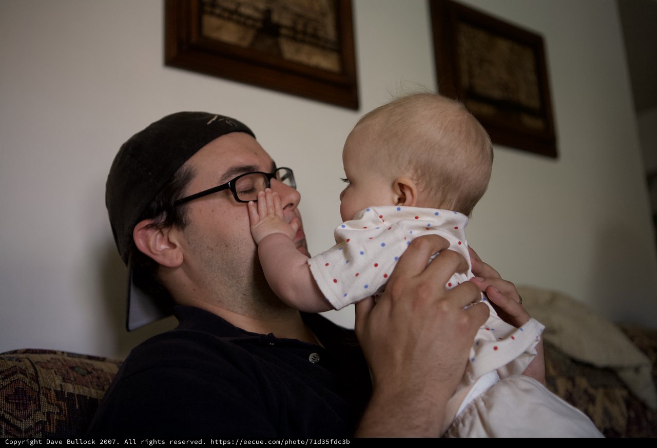 Father and Baby Share a Tender Indoor Moment