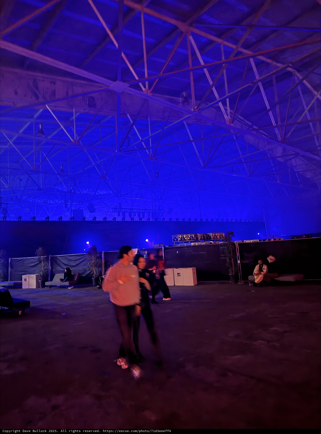 Blue-Lit Warehouse Rave Before Electronic Music Performance