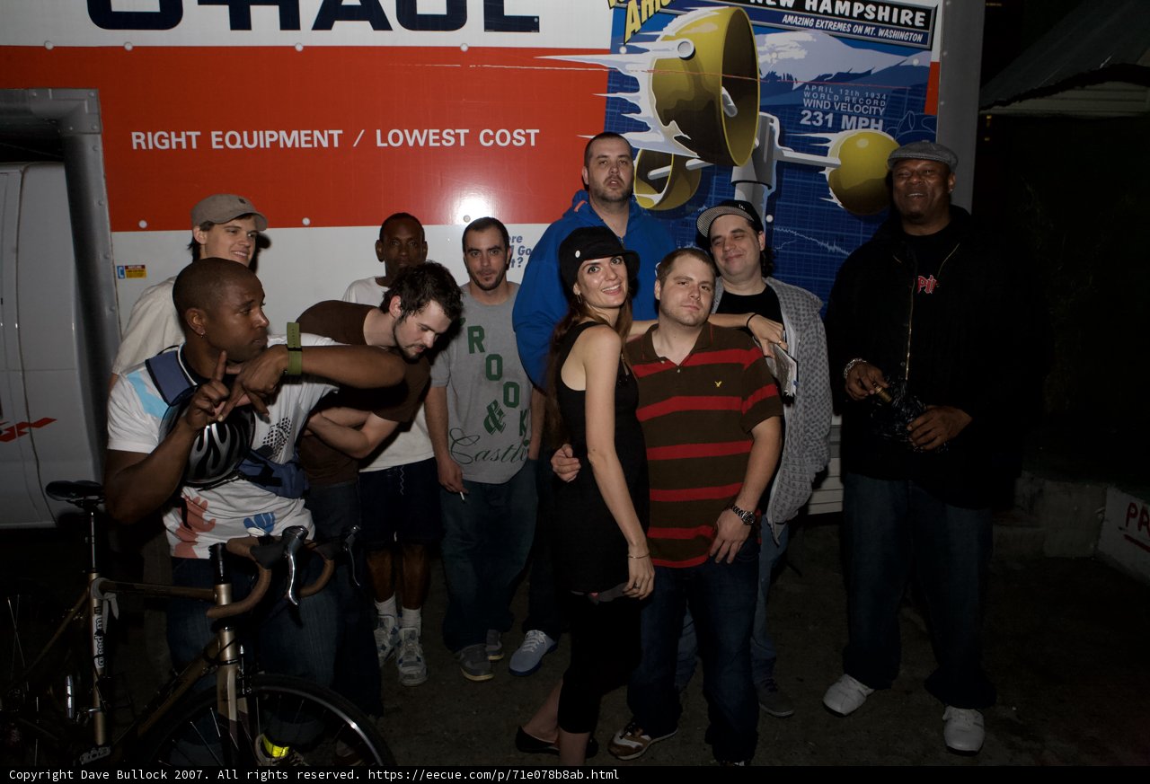 Group Poses in Front of Mighty Machine
