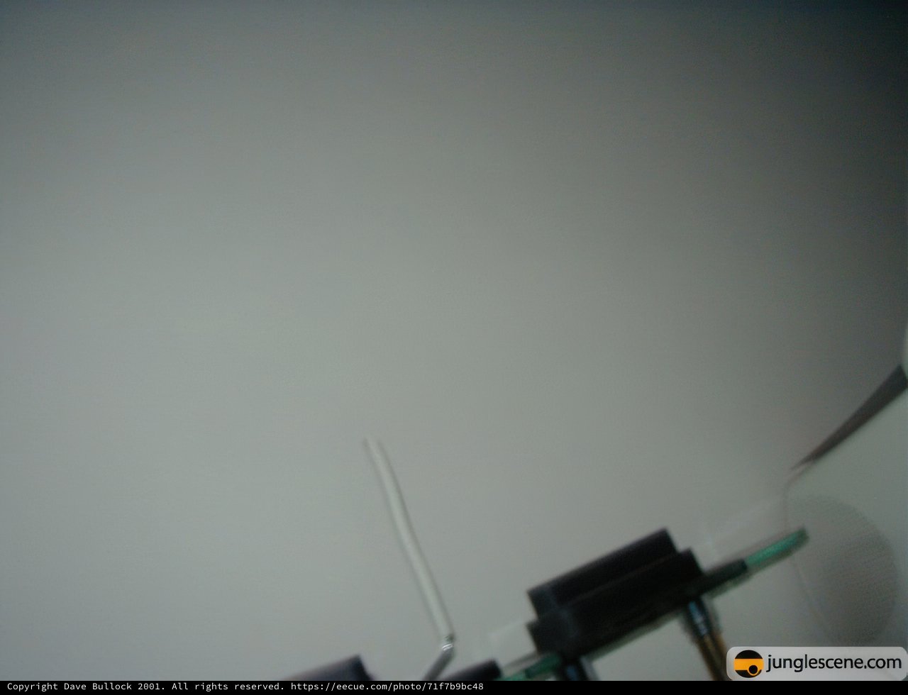Miniature Black Screen on White Wall