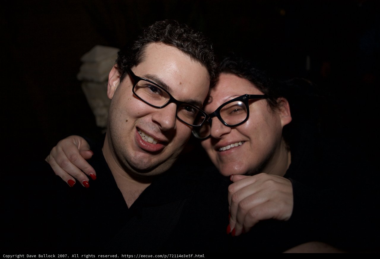 Glasses-clad Couple Strikes a Pose
