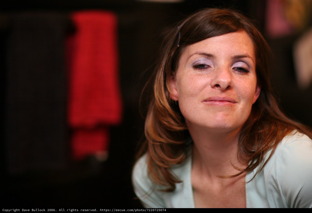 Contemplative Woman in Soft Indoor Light